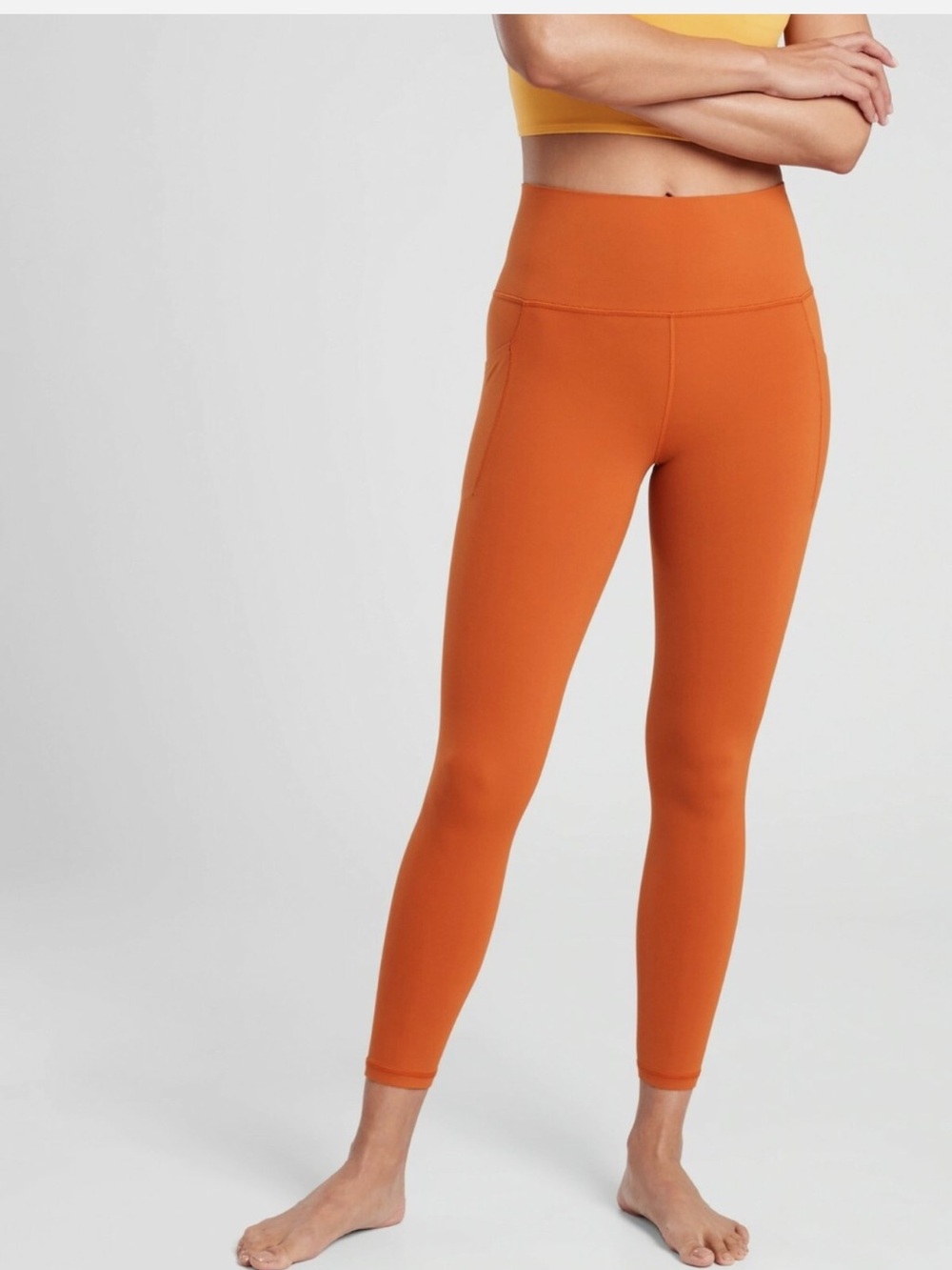 Athleta Salutation Stash Pocket II Tight Legging Size M/P Orange
